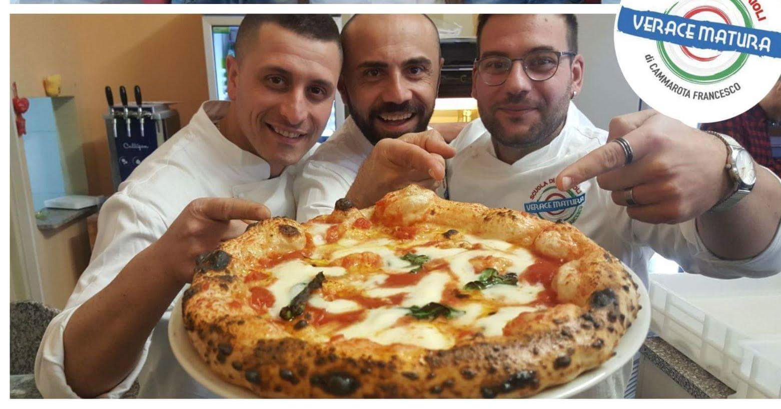 The Mamma Mia Pizza Party team with a freshly baked Neapolitan pizza