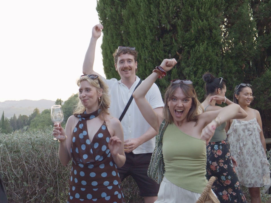Guests enjoying an outdoor celebration in the Tuscan countryside